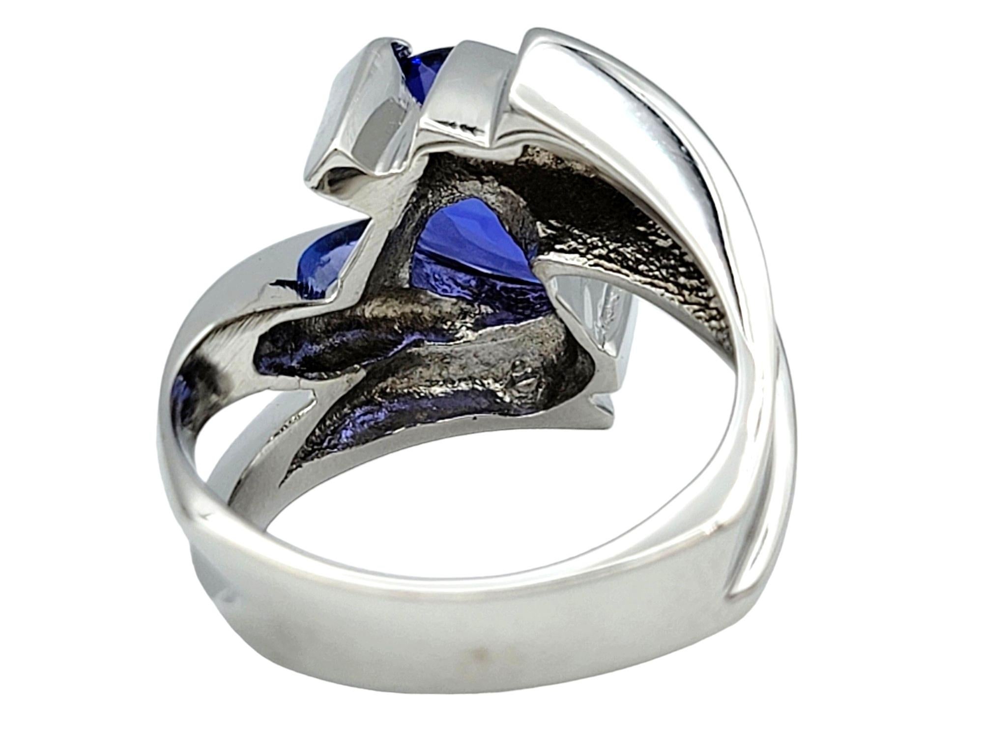 Pear Cut Tanzanite and Diamond Bypass Style Ring Set in 14 Karat White Gold For Sale 1