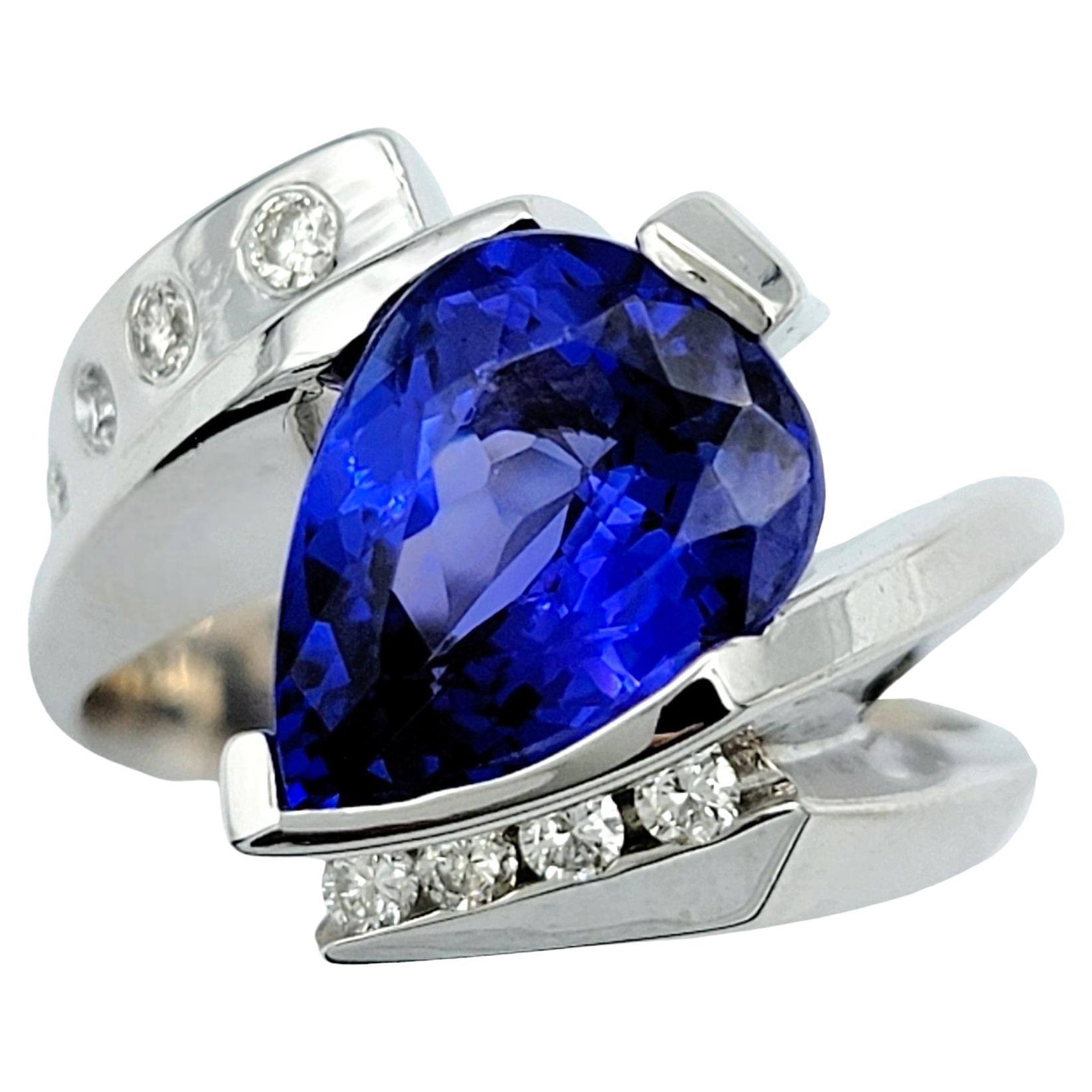 Pear Cut Tanzanite and Diamond Bypass Style Ring Set in 14 Karat White Gold For Sale