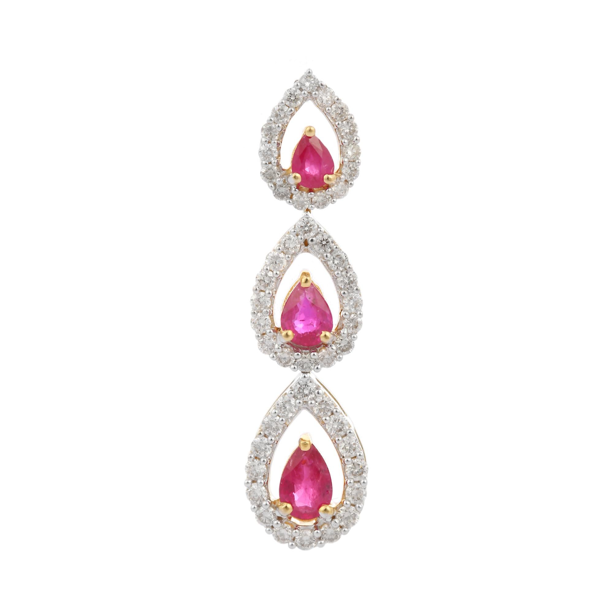 Pear cut three stone ruby diamond pendant in 18K Gold. It has a pear cut ruby with halo diamonds that completes your look with a decent touch. Pendants are used to wear or gifted to represent love and promises. It's an attractive jewelry piece that