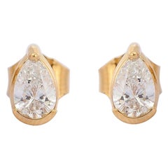 Clous d'oreilles en or 18 carats avec diamants en forme de poire