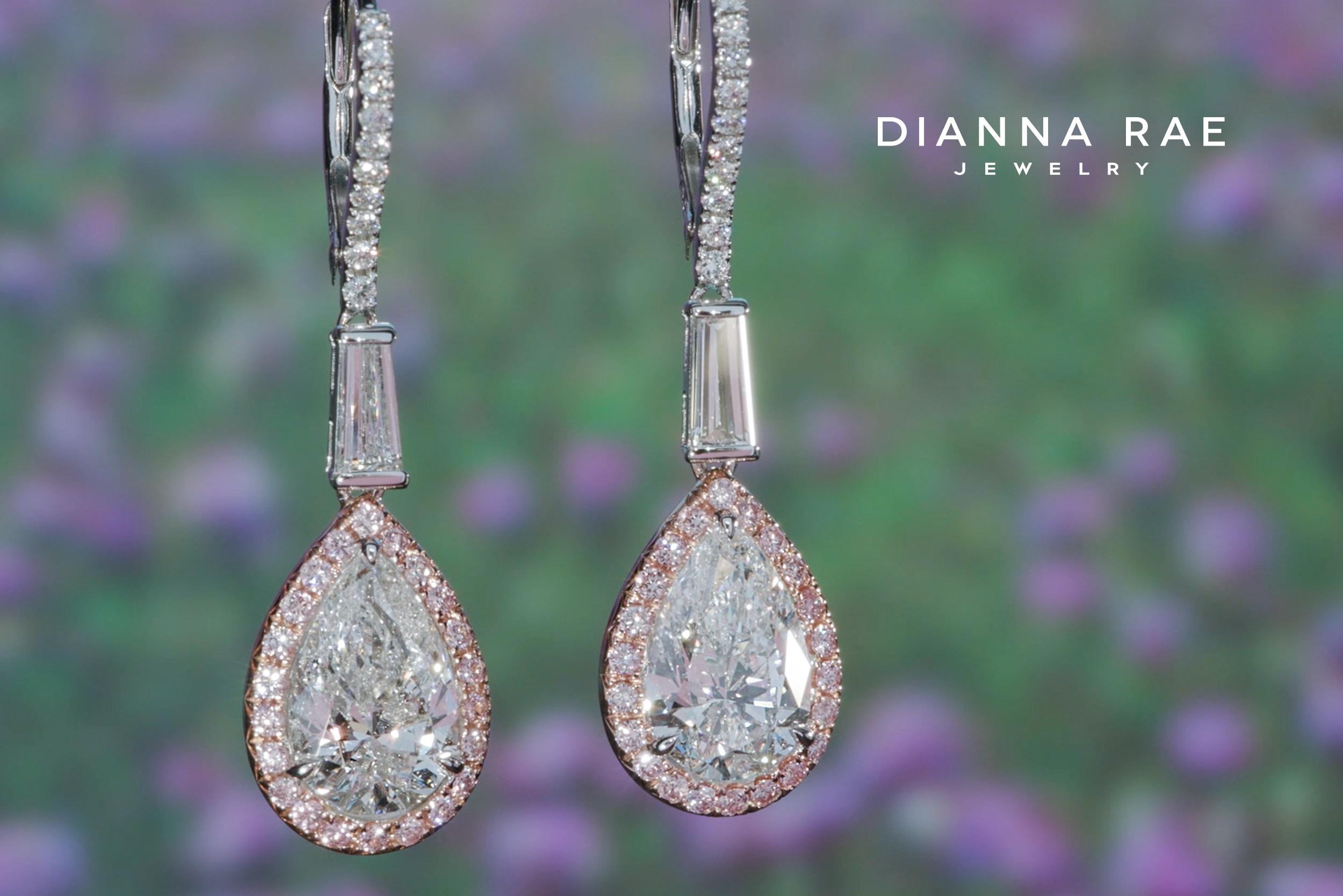 Set in 18k white and rose gold, these 5.16 carat total weight pear shape diamond dangle earrings are accented with 44 sparkling natural pink diamonds.

Pear shape Diamonds 4.04 cts TW D SI2
Taper baguette Diamonds 0.55 cts TW
0.41 cts TW round