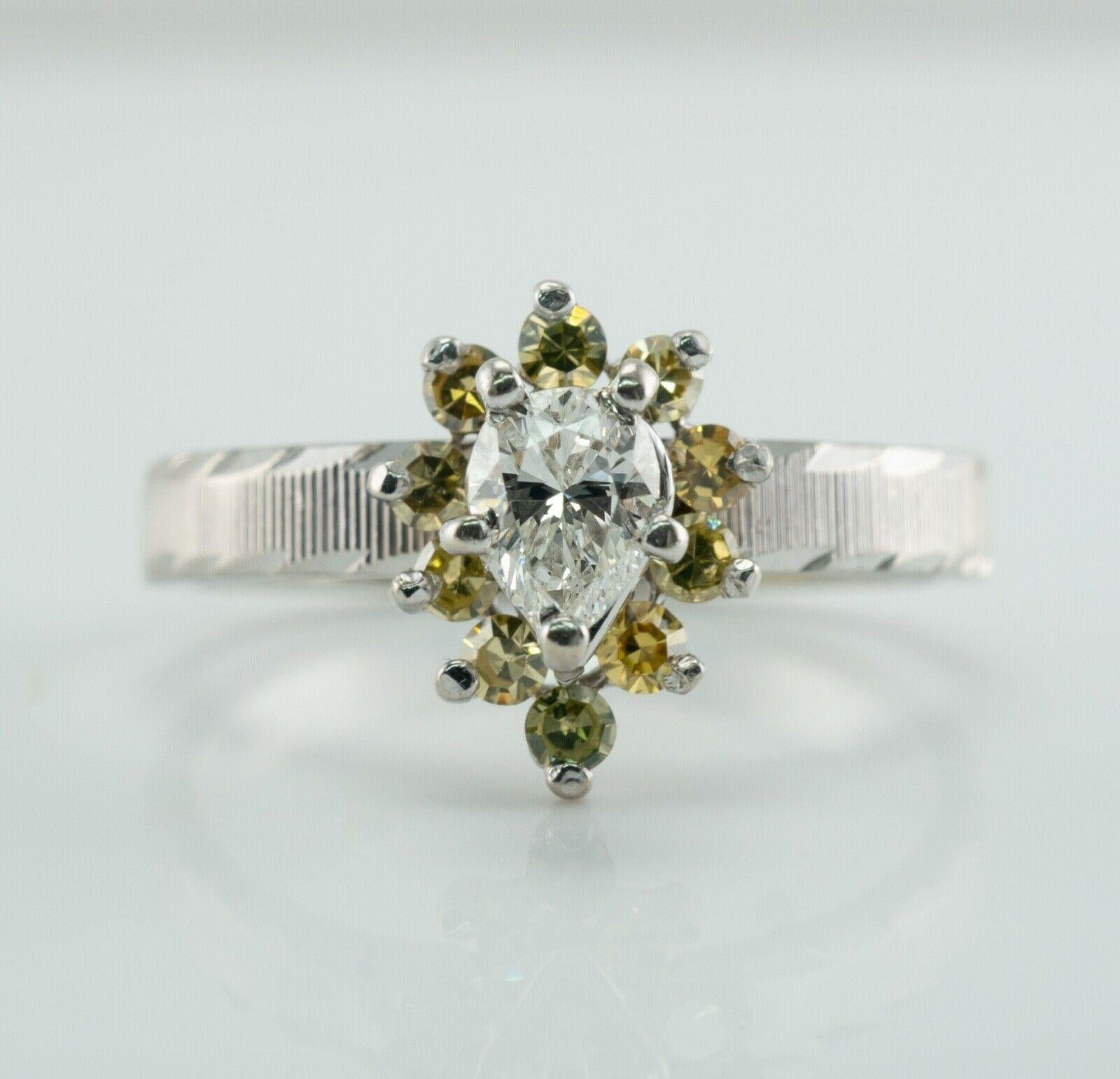 Pear Diamond Ring Canary Sapphire 14K White Gold Engagement

This estate engagement ring is finely crafted in solid 14K White Gold.
The ring hallmarked 