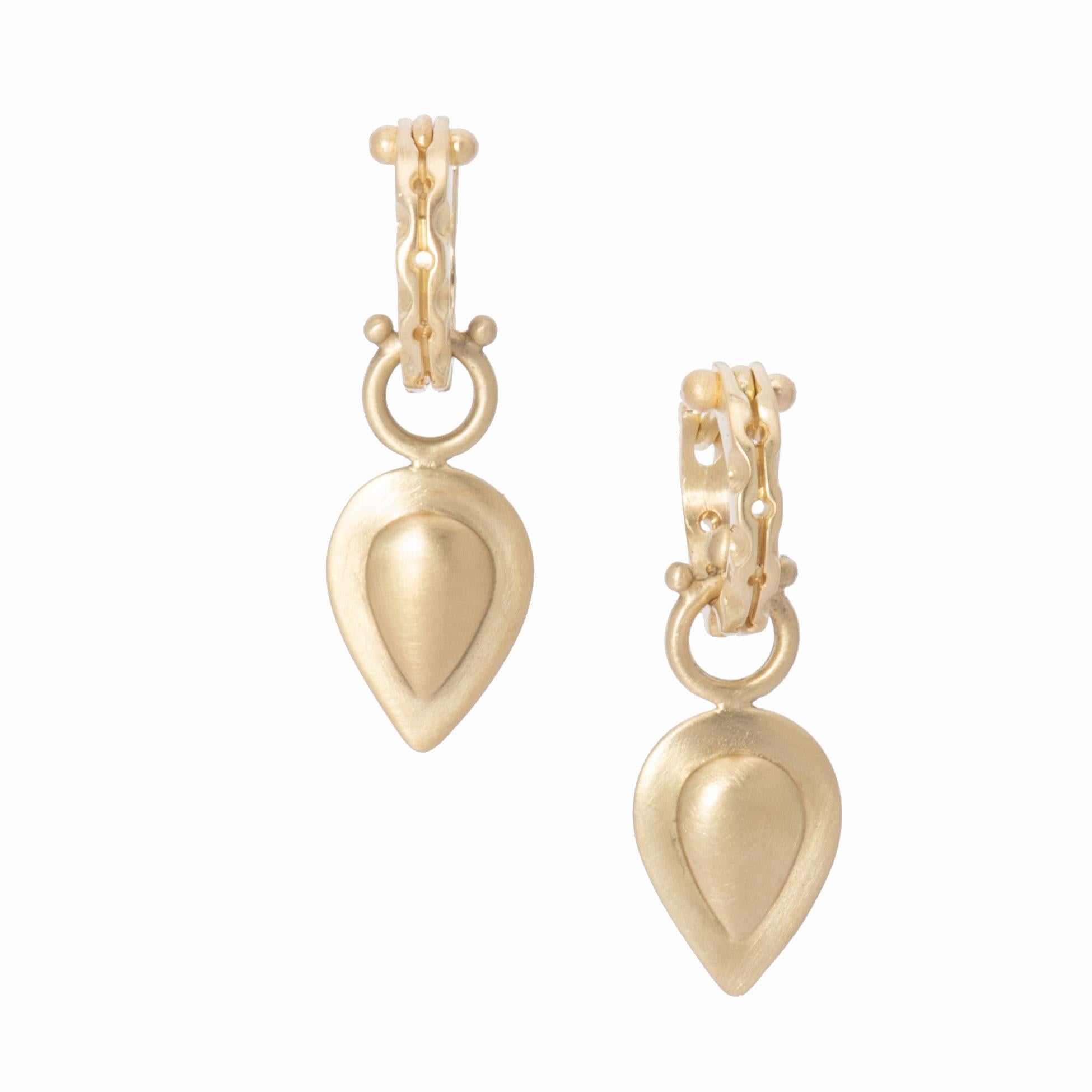 This flattering teardrop shape makes a simple, stylish statement in luscious 18k gold. The repousse design in our satin finished 18k gold is hand crafted in our studio and the result is a light weight, 3-dimensional Pear Drop, beaded on the bail and