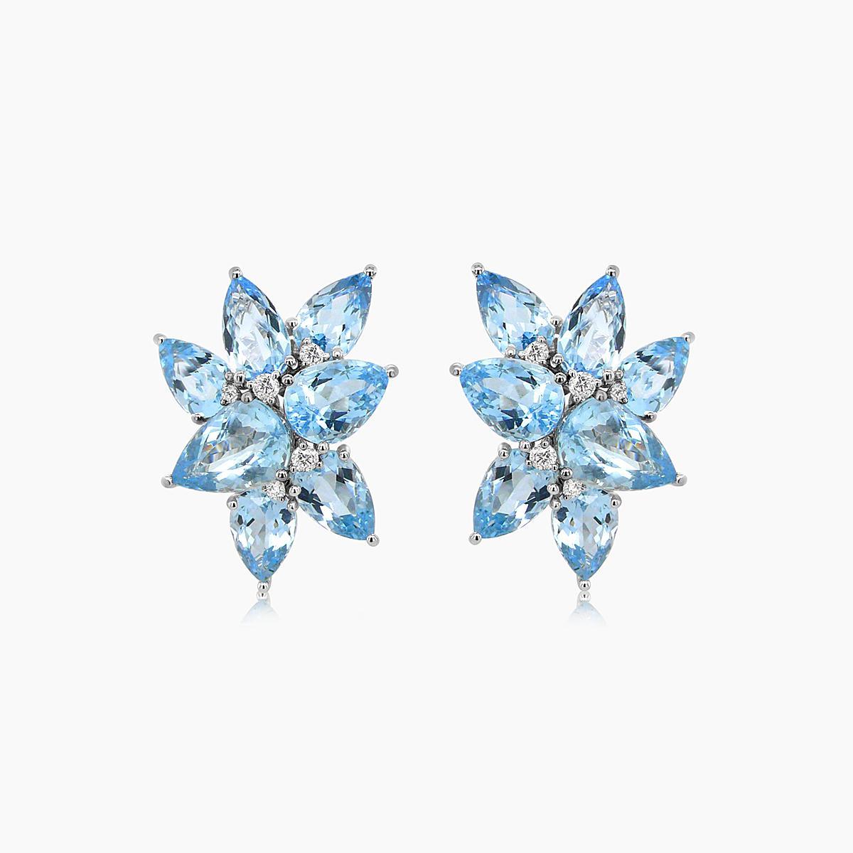 Elegant 21st Century Aquamarine Cluster Earrings. This stunning pair features aquamarine stones arranged in a floral cluster design. The earrings showcase pear-shaped aquamarines, creating a captivating sparkle. Crafted with precision, these