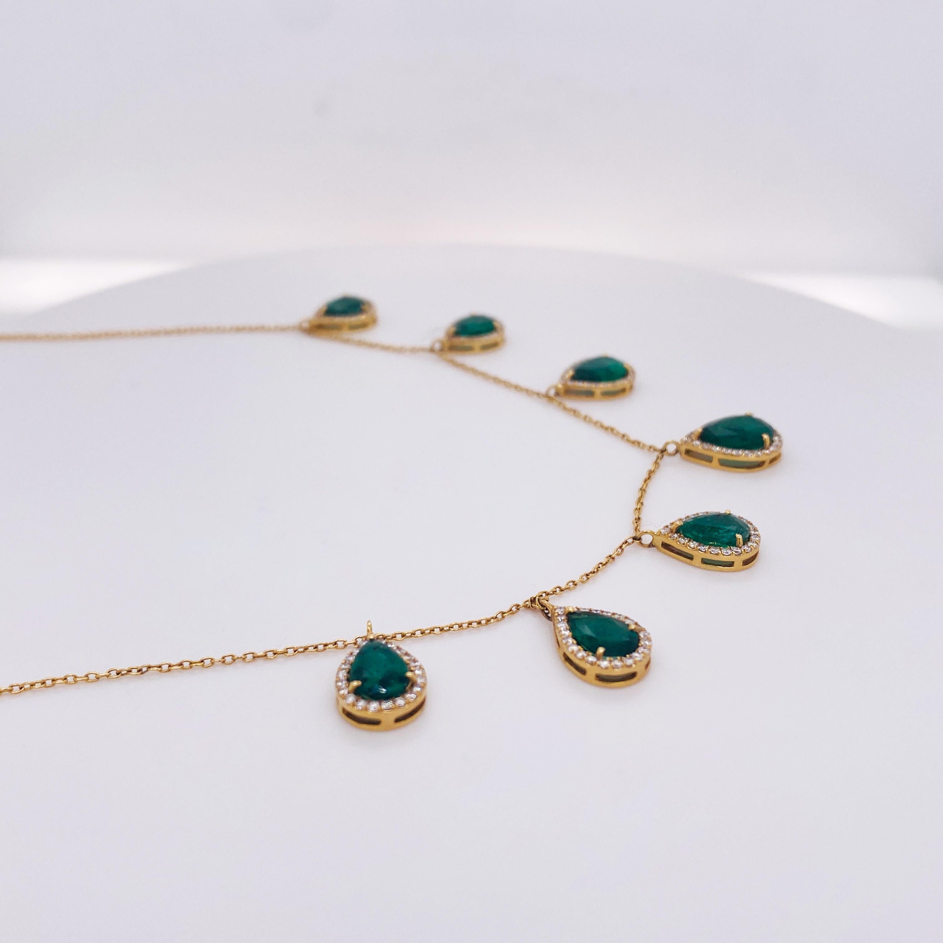 Rock the look you love with these magnificent emerald and diamond drops! Your jewelry collection will be as stunning as yourself with this cascading necklace of emeralds ringed with diamonds! Emeralds are the birthstone for May. This show stopping
