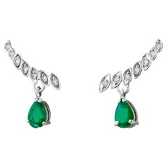 Pear emerald earrings studs. Emerald and diamonds earrings.