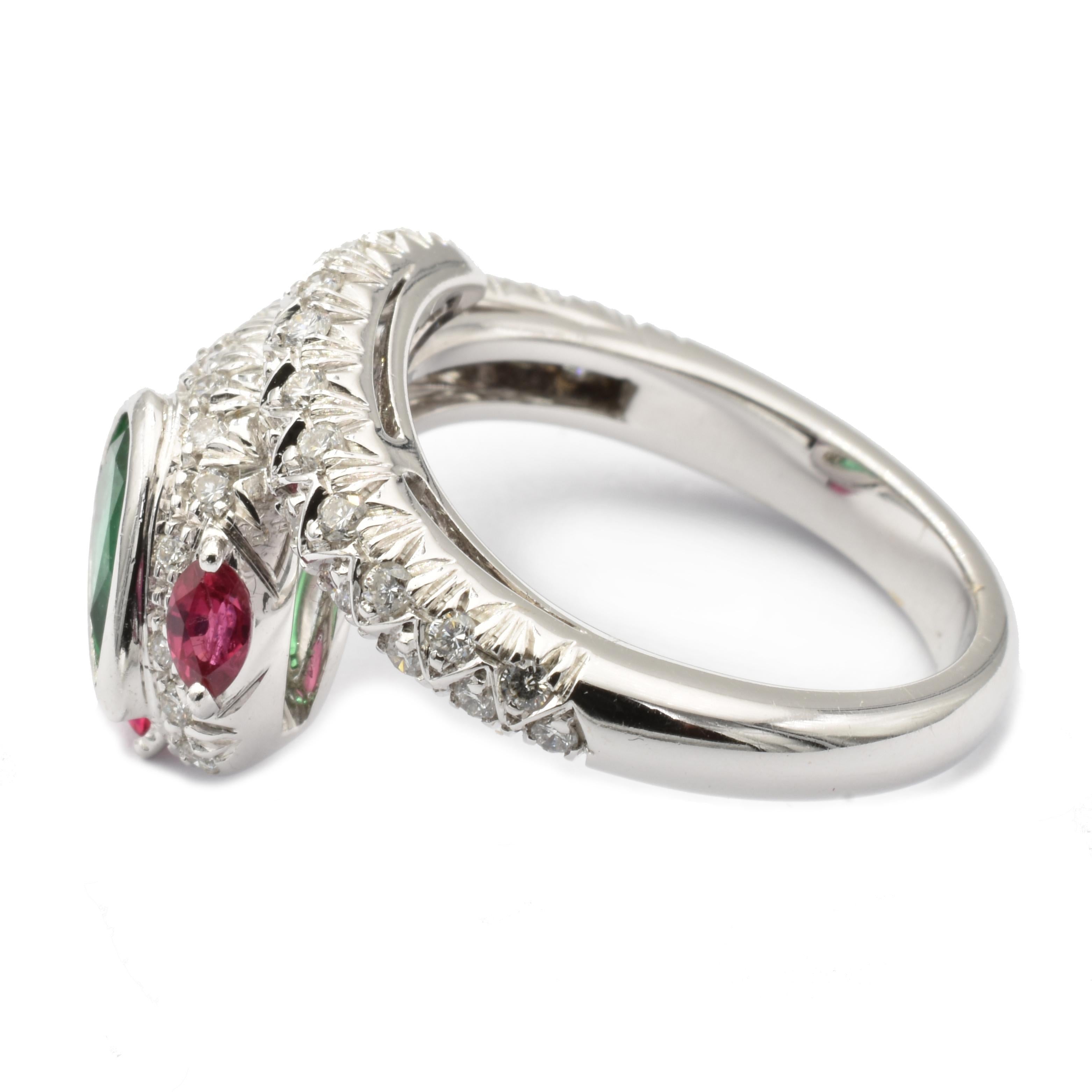 Gilberto Cassola 18Kt White Gold Snake Ring with a Pear Emerald, two Marquise Rubies and Diamonds.
Handmade in our Atelier in Valenza Italy.
Bright Green Natural Emerald Pear sized mm 7.80 X 4.20.  Weight ct 0.60
Intense Red Natural Ruby Marquises