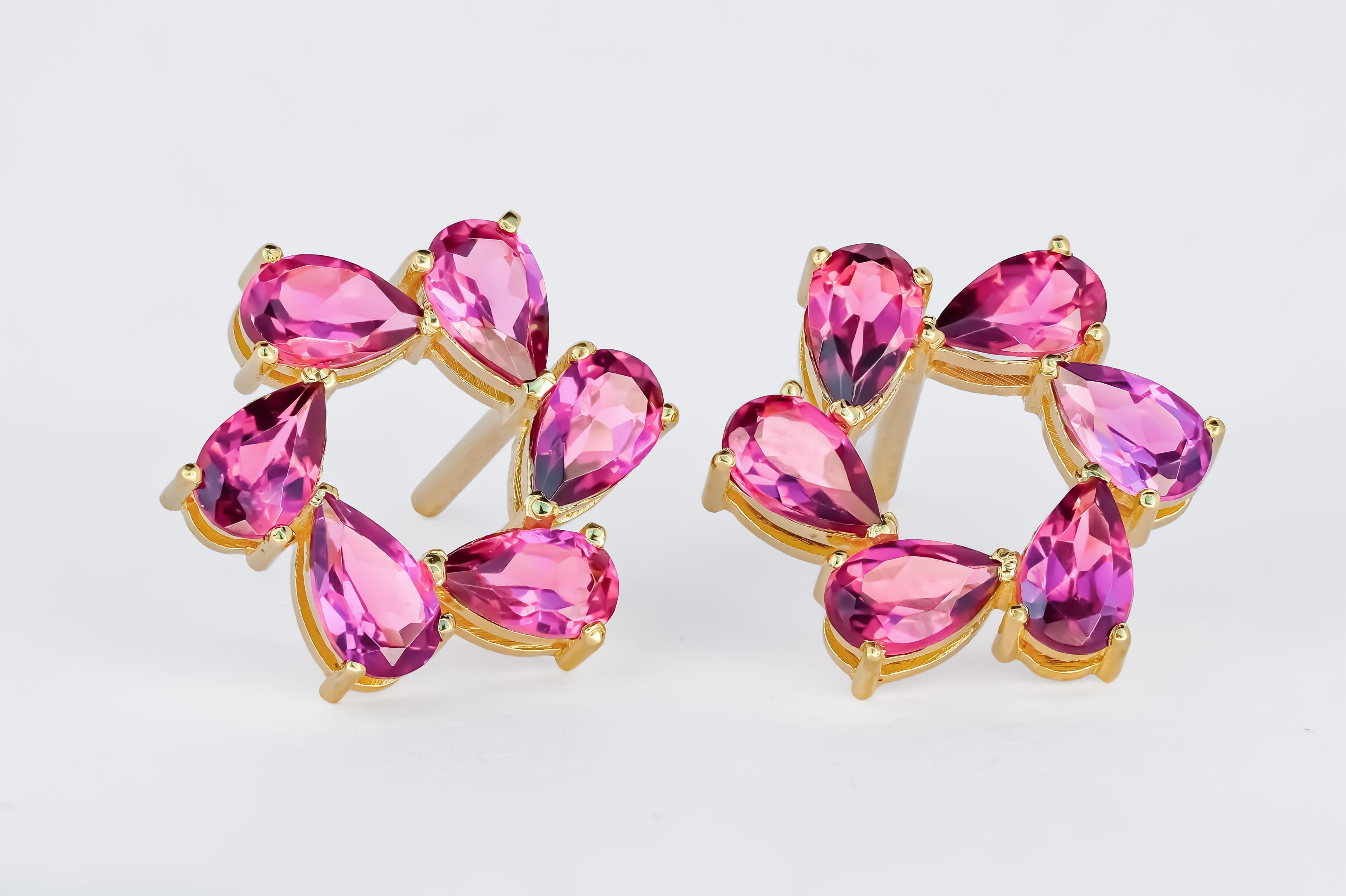 Modern Pear garnet earrings studs in 14k gold.
