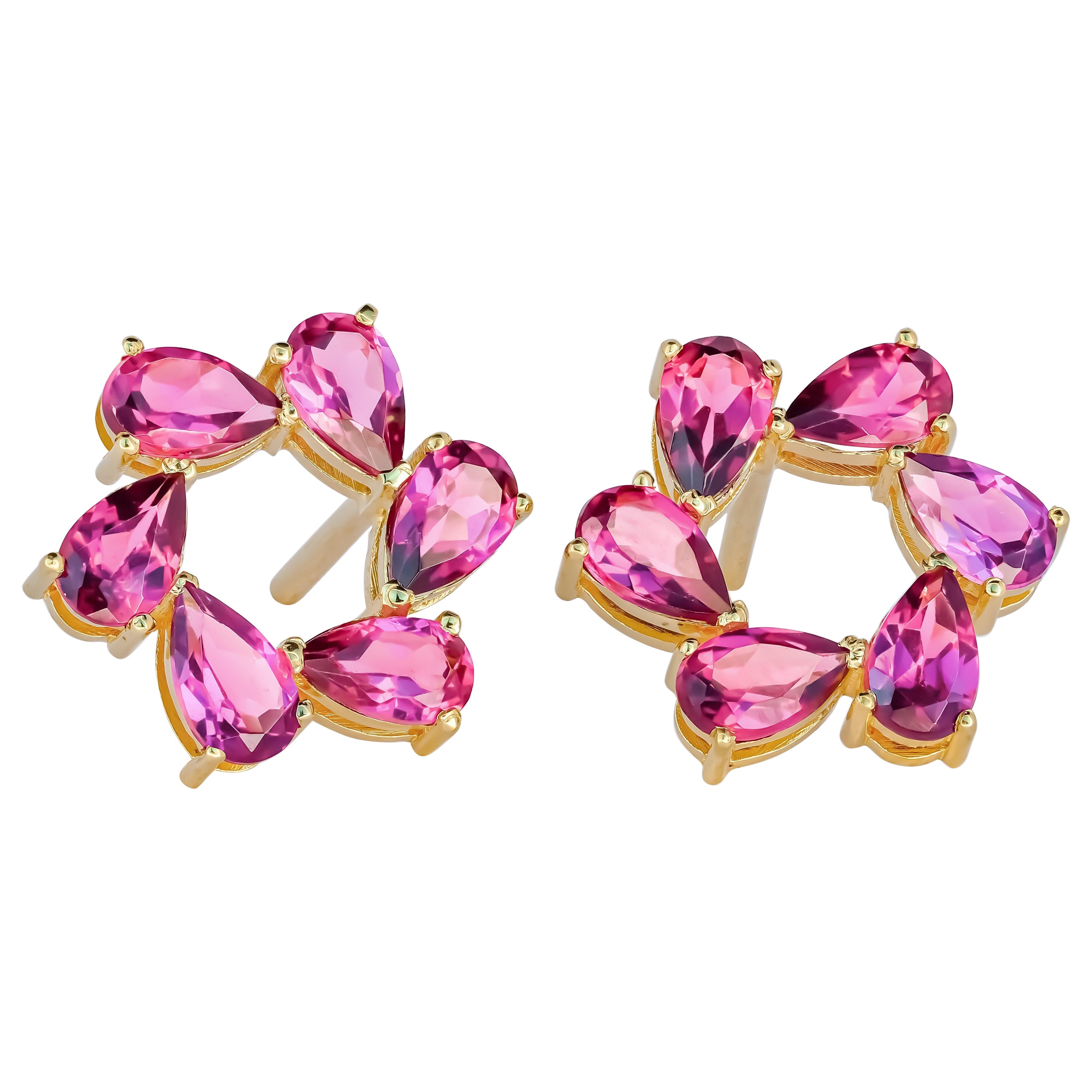 Pear garnet earrings studs in 14k gold.