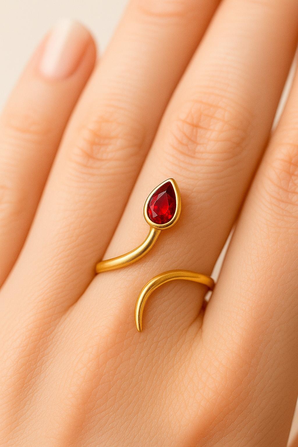 in vendita:  Anello in oro 14k con apertura a pera e granato 4