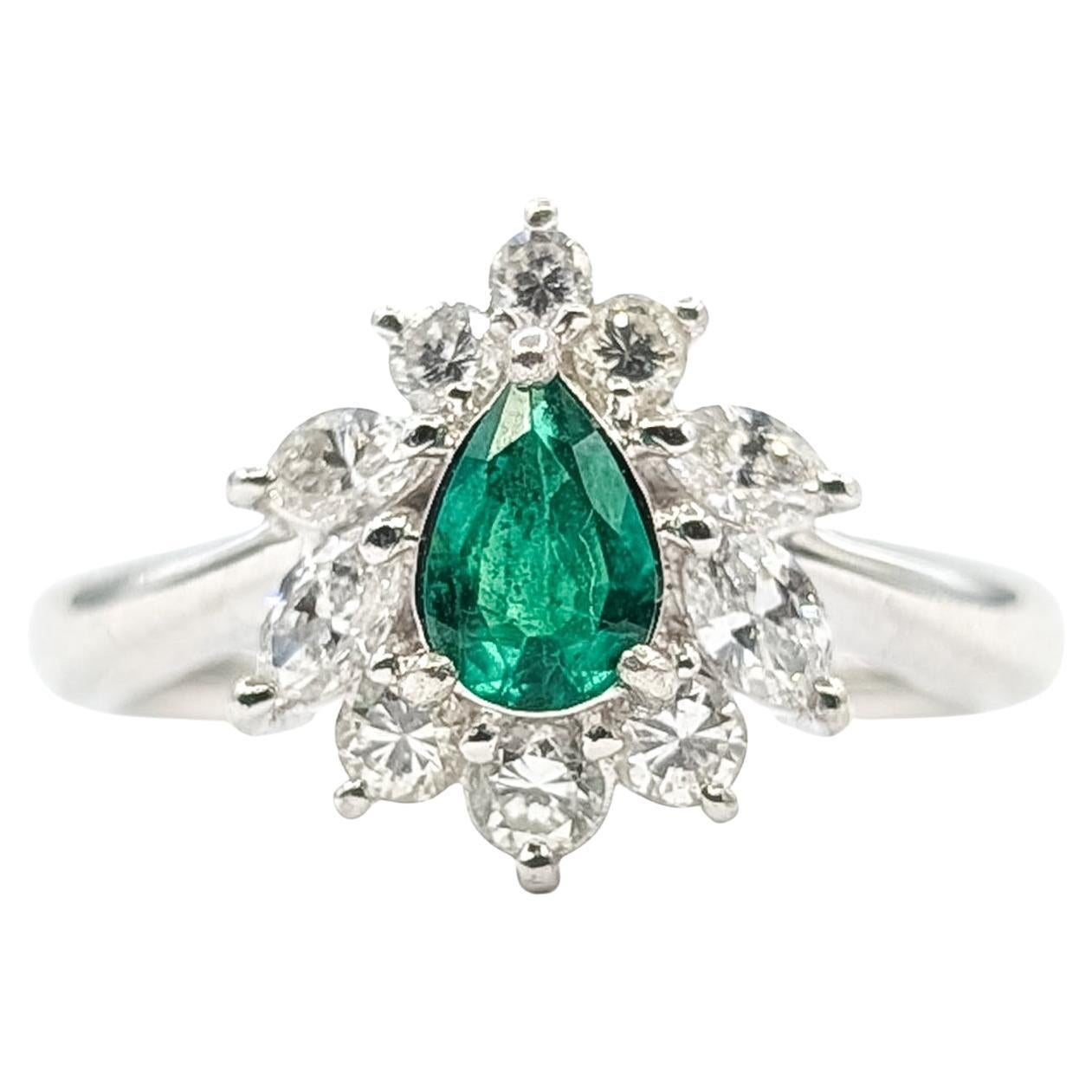 Pear Halo Emerald & Diamond Ring in platinum
