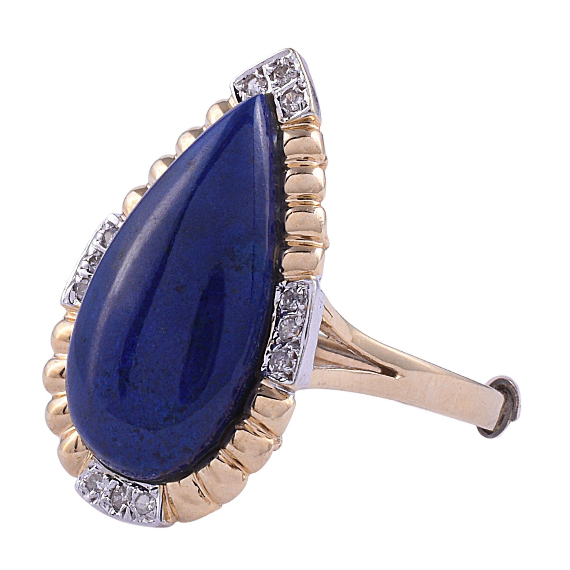 Estate pear lapis ring with diamond accents. This estate lapis ring is crafted in 14 karat gold. The estate ring features a pear or teardrop lapis that is accented with 12 small diamonds. The teardrop lapis ring is a size 7.75. [SJ 2112D