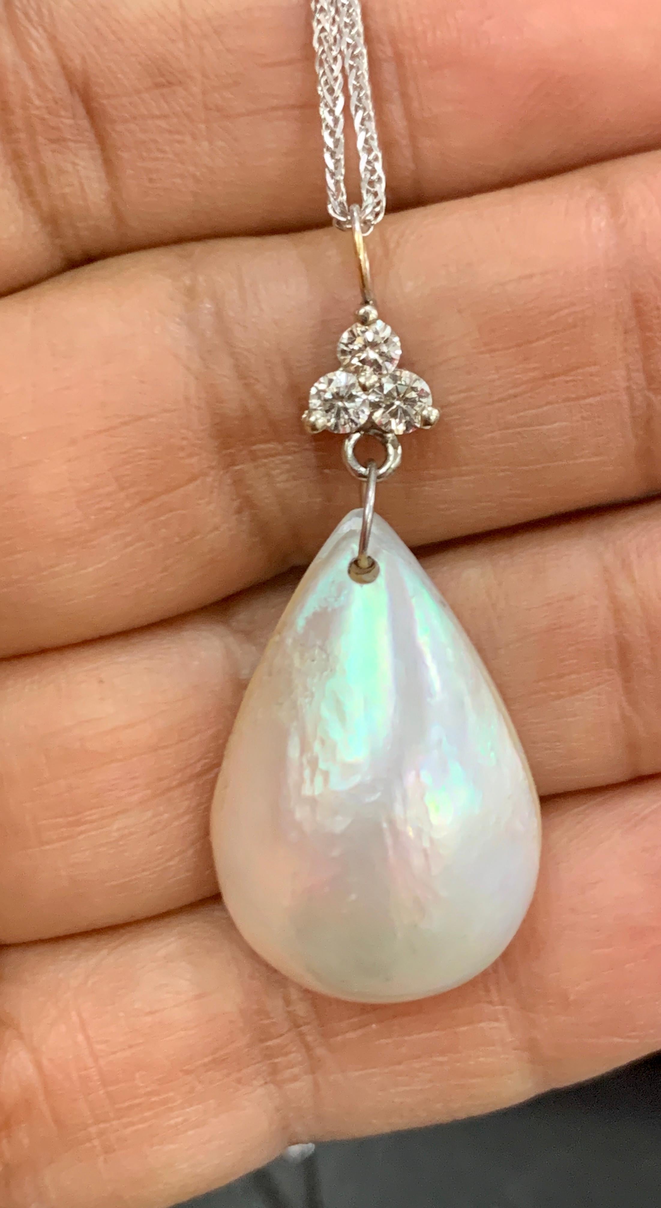 Pear Mabe Pearl & 0.36 Ct Diamond  Pendant/ Necklace 14 Kt White Gold with Chain
17 mm wide and 25 mm tall pear shape mabe pearl wit three diamonds approximately 0.36 ct 
Diamond Weight  approximately 0.35 Carats
Diamonds are SI quality.
14 K gold