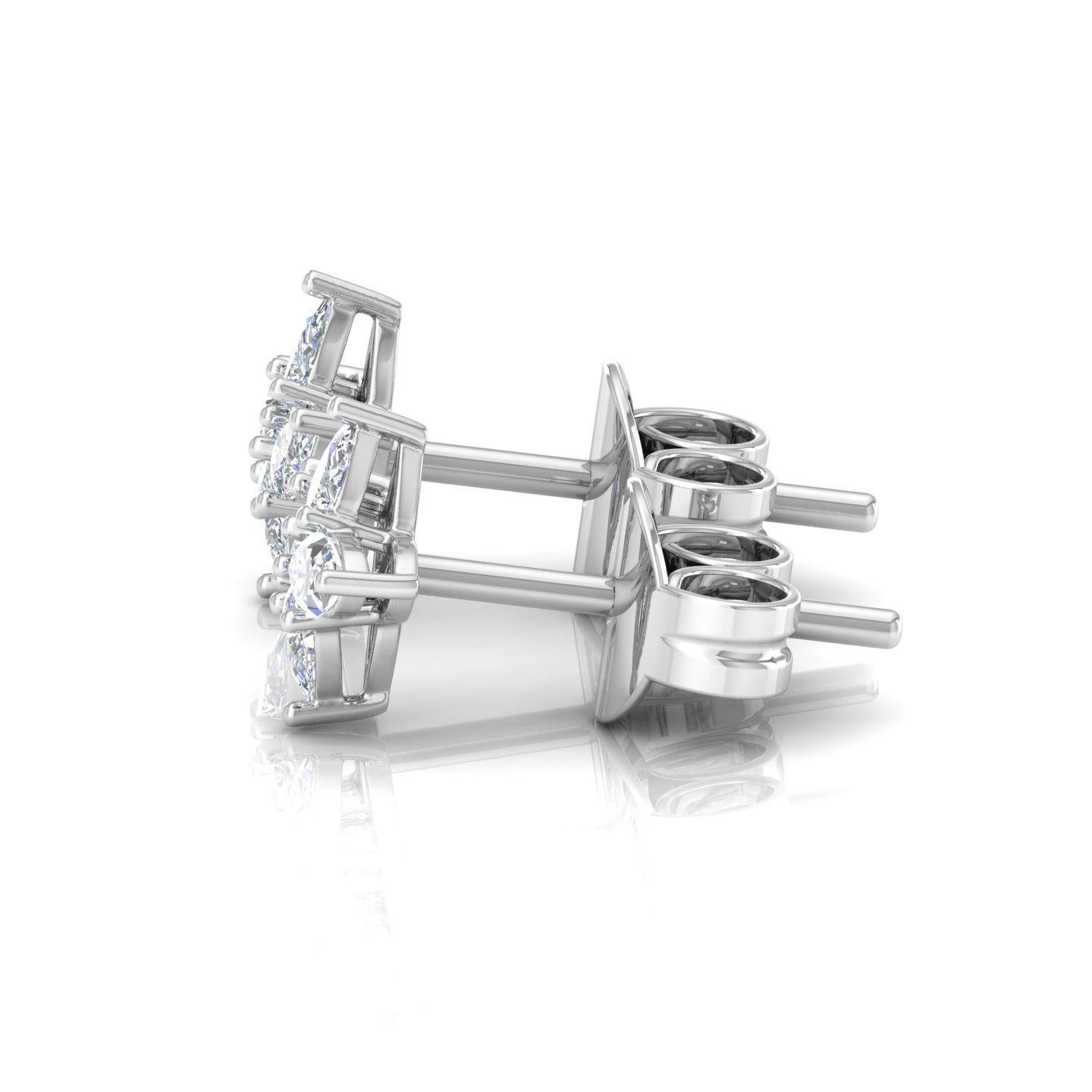 These exquisite stud earrings are meticulously handcrafted from 18-karat white gold and feature pear and marquise-cut diamonds. The combination of these diamond shapes creates a captivating and unique design that is sure to catch attention. The