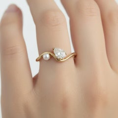 Pear moissanite and pearl 14k gold ring