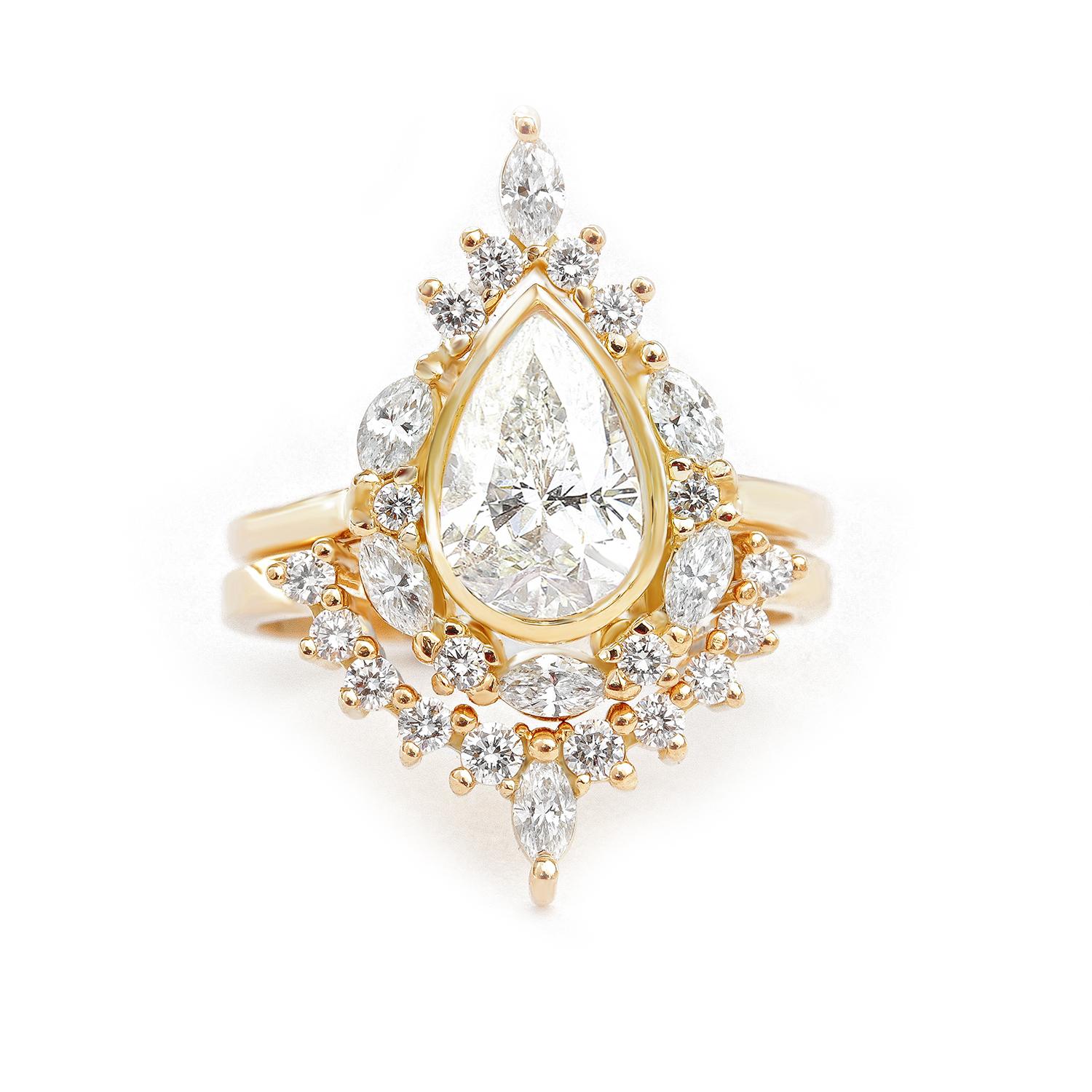 Pear Moissanite and unique diamond halo, Engagement Rings Set - Eva.
The Eva ring is named after the first woman Eva who is graceful, passionate, and full of energy & laughter. 
Handmade with care. 
An original design by Silly Shiny Diamonds. 

This