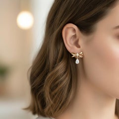 Pear moissanite drop bow earrings studs in 14k gold