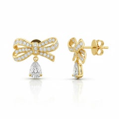 Pear moissanite drop bow earrings studs in 14k gold