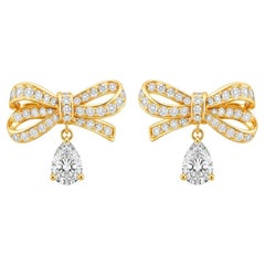 Pear moissanite drop bow earrings studs in 14k gold