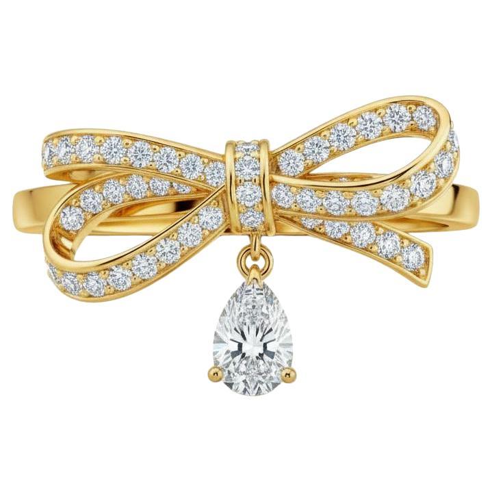 For Sale:  Pear moissanite drop bow ring in 14k gold