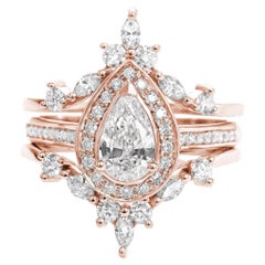 Anello di fidanzamento aureolato in moissanite a pera con guardia anulare in diamante "Nia" e "Islanda"