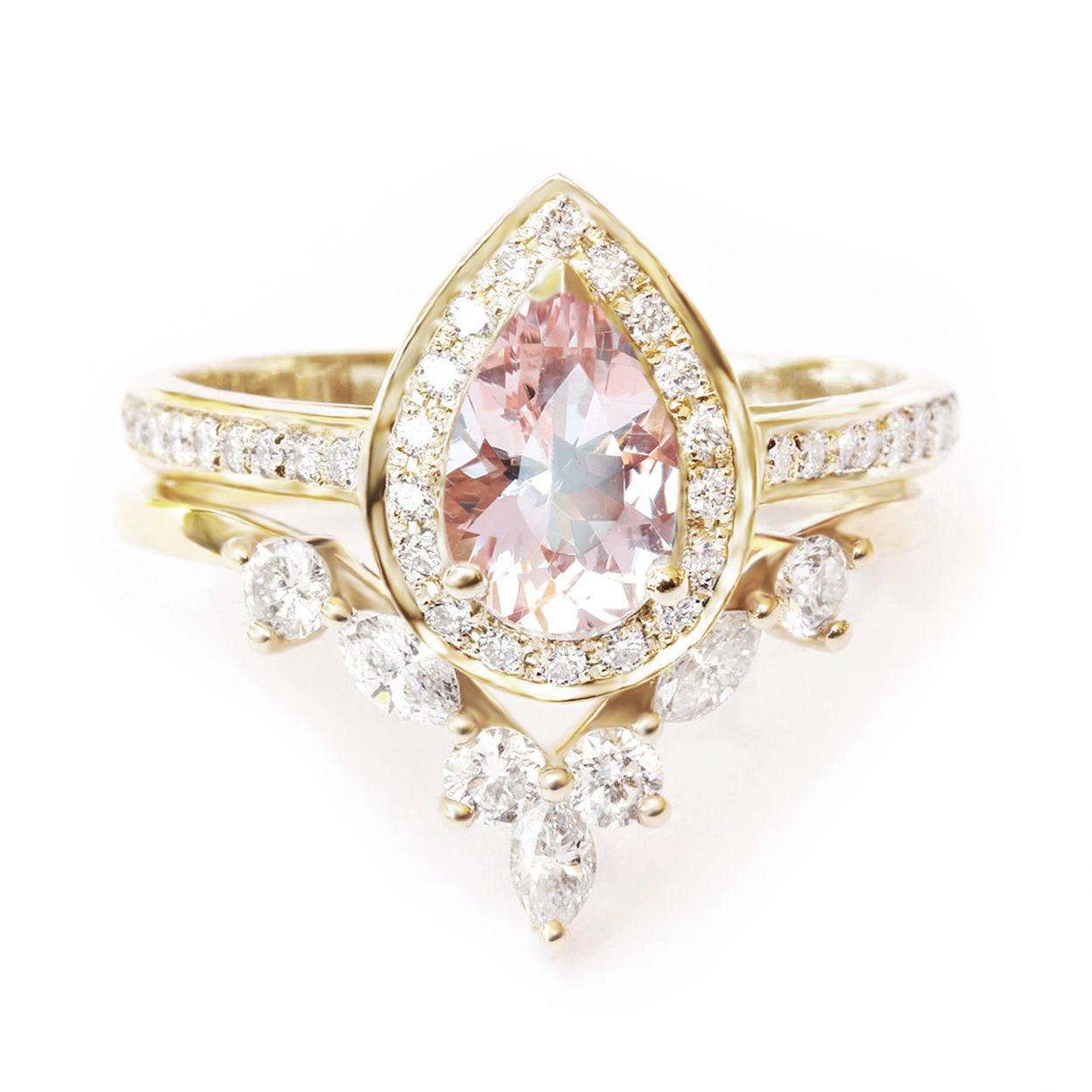 Beautiful pear shape Morganite Halo engagement ring set with a diamond wedding band.
The list is for the two ring set.
Hand made with care. 
An original design by Silly Shiny Diamonds. 

Details: 
* Center Stone Shape: Pear shape. 
* Center Stone