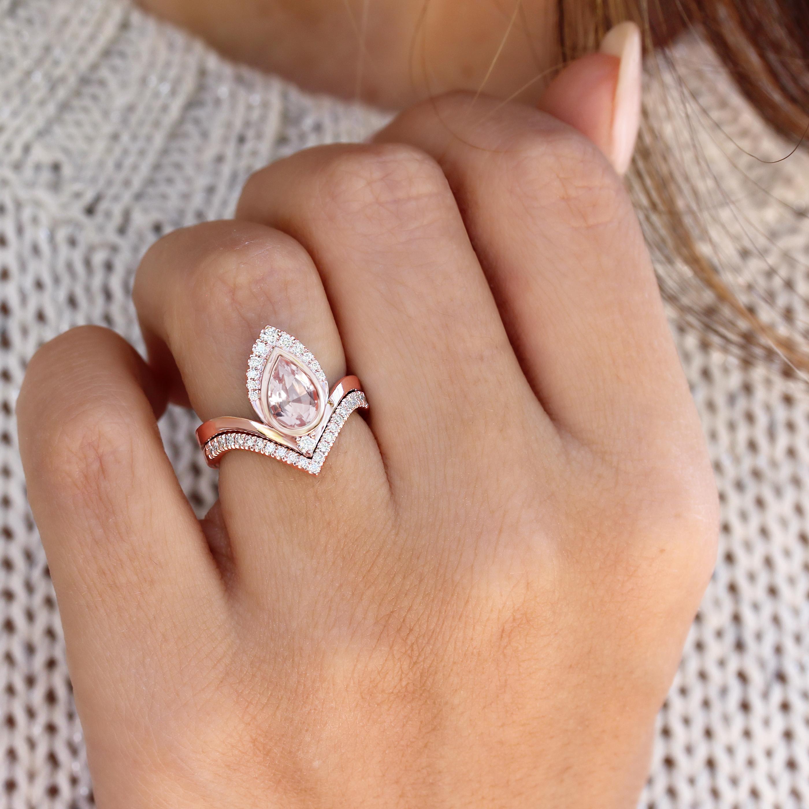 Beautiful pear-shaped Morganite and diamond engagement ring set.
Beautiful and outstanding design, royal look.
The list is for two ring set. 
Hand made with care. 
An original design by Silly Shiny Diamonds. 

Details: 
* Center Stone Shape: Pear