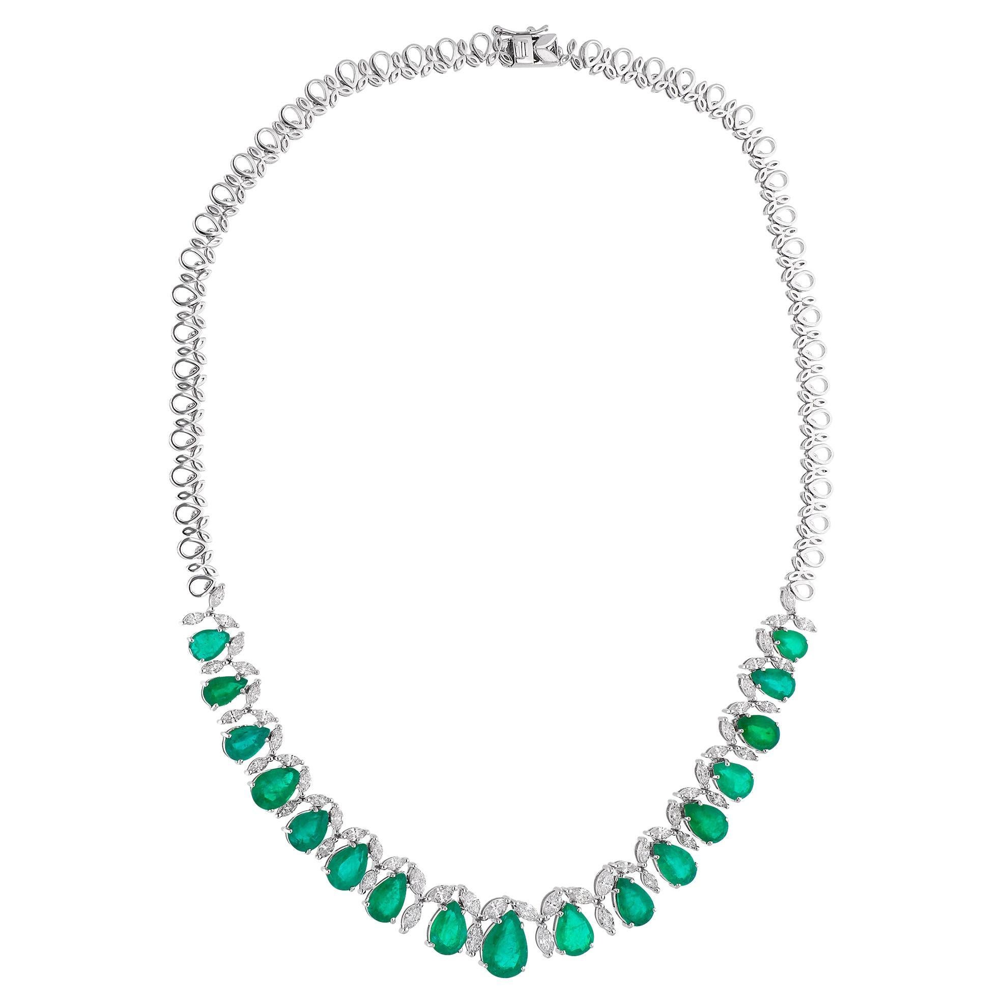 Experience the exquisite elegance of this Pear Natural Emerald Choker Necklace adorned with Marquise Diamonds. Handcrafted with meticulous care, this stunning piece features a pear-shaped natural emerald gemstone gracefully accompanied by shimmering