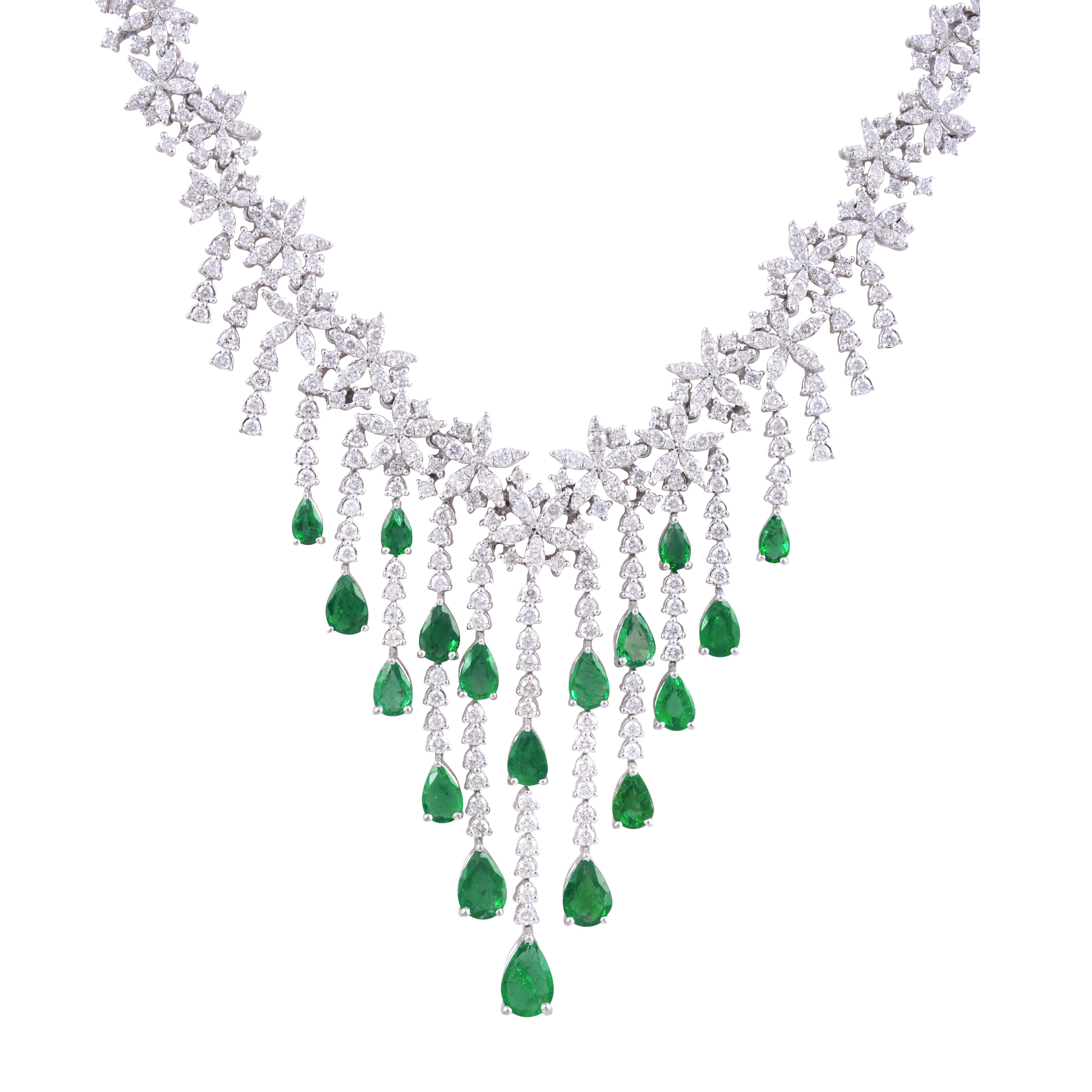 Complementing the emerald are dazzling diamonds that add a touch of brilliance and sophistication. These diamonds are meticulously chosen for their exceptional quality, exhibiting exceptional sparkle and fire. Their presence enhances the overall