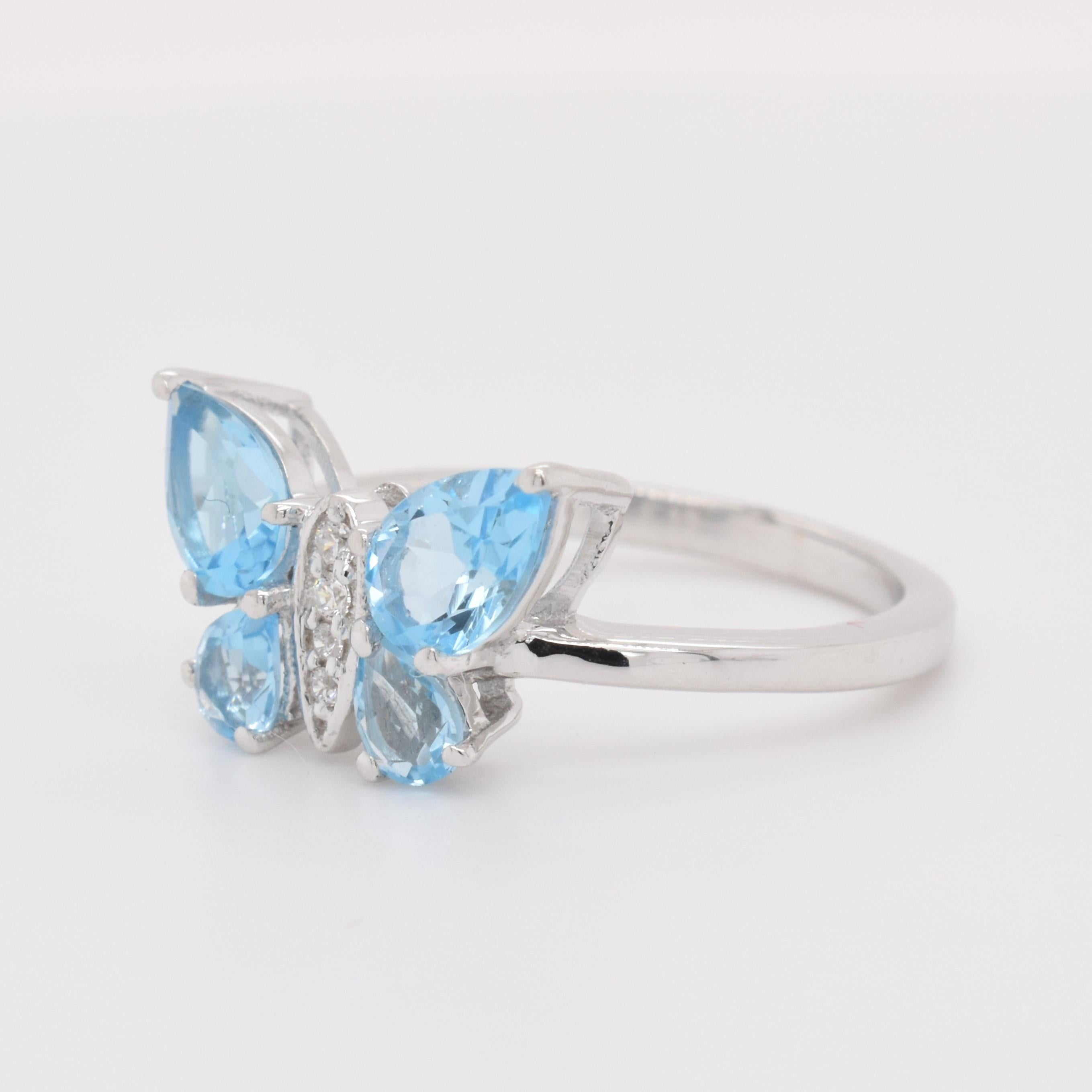 Pear Shape Swiss Blue Topaz Gemstone beautifully crafted with CZ in a Ring. A fiery Blue color December Birthstone. For a special occasion like Engagement or Proposal or may be as a gift for a special person.

Primary Stone Size - 6x4 & 4x3 mm