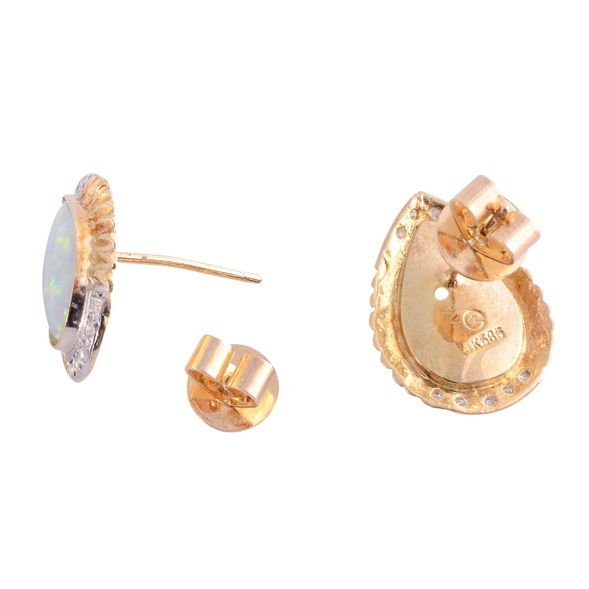 Estate pear opal earrings. These 14 karat yellow gold earrings feature two pear opals at 2.30 carat total weight accented with .10 carat total weight in single cut diamonds. The diamonds have VS1-2 clarity and G-I color. These pear opal earrings are