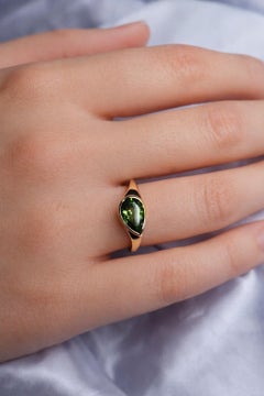 Pear peridot east west ring