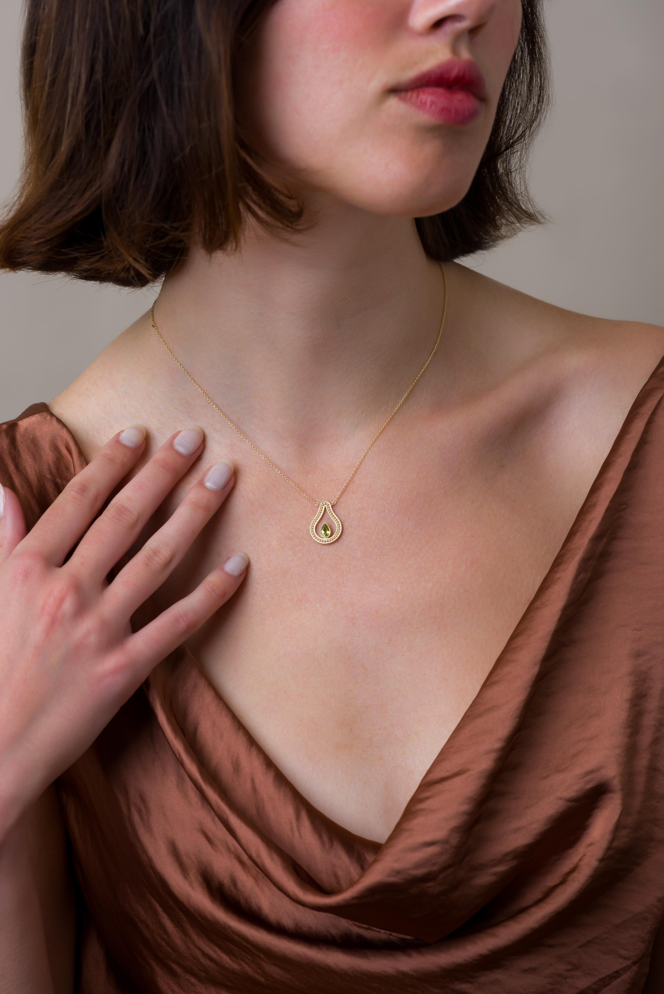 Embrace the allure of our exquisite gold pear pendant, intricately adorned with granulations and graced by a resplendent pear peridot—a symbol of natural elegance and timeless charm.

100% handmade in our workshop.

Metal: 18K Gold
Gemstones: Pear