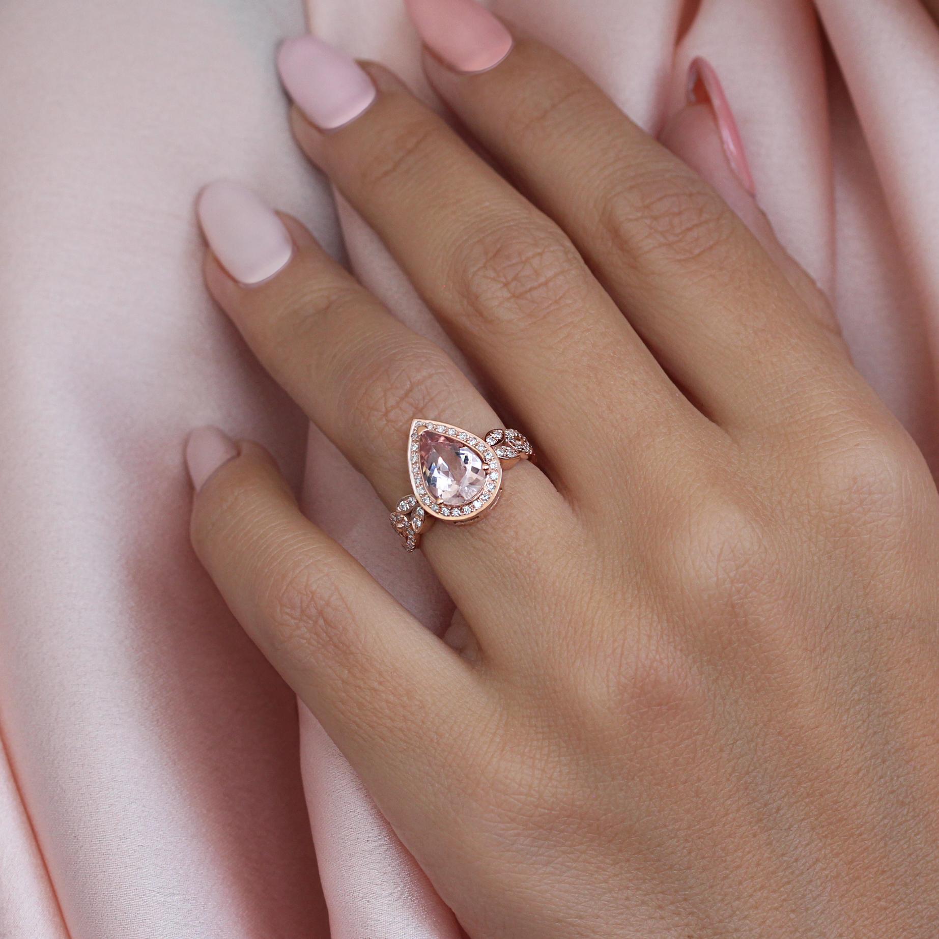 Pear-shaped morganite engagement wave band ring.
The list is for the engagement ring only.
Handmade with care. 
An original design by Silly Shiny Diamonds. 

Details:
* Center stone shape: Pear shape.
* Center stone type: Natural morganite,