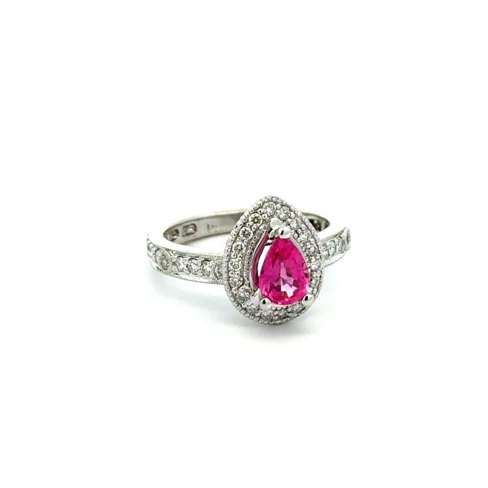 Simply Beautiful! Vintage Solitaire Pear Pink Spinel and Diamond Gold Ring. Centering a securely nestled and Hand set 0.72 Carat Pear Pink Spinel. Surrounded by Round Brilliant Cut Diamonds, weighing approx. 0.40tcw. Hand crafted 14K White Gold
