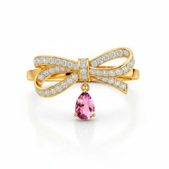 Pear pink tourmaline drop bow ring in 14k gold