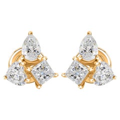 Orecchini a bottone con diamanti naturali taglio "pear" e "trillion" in oro giallo 18 carati