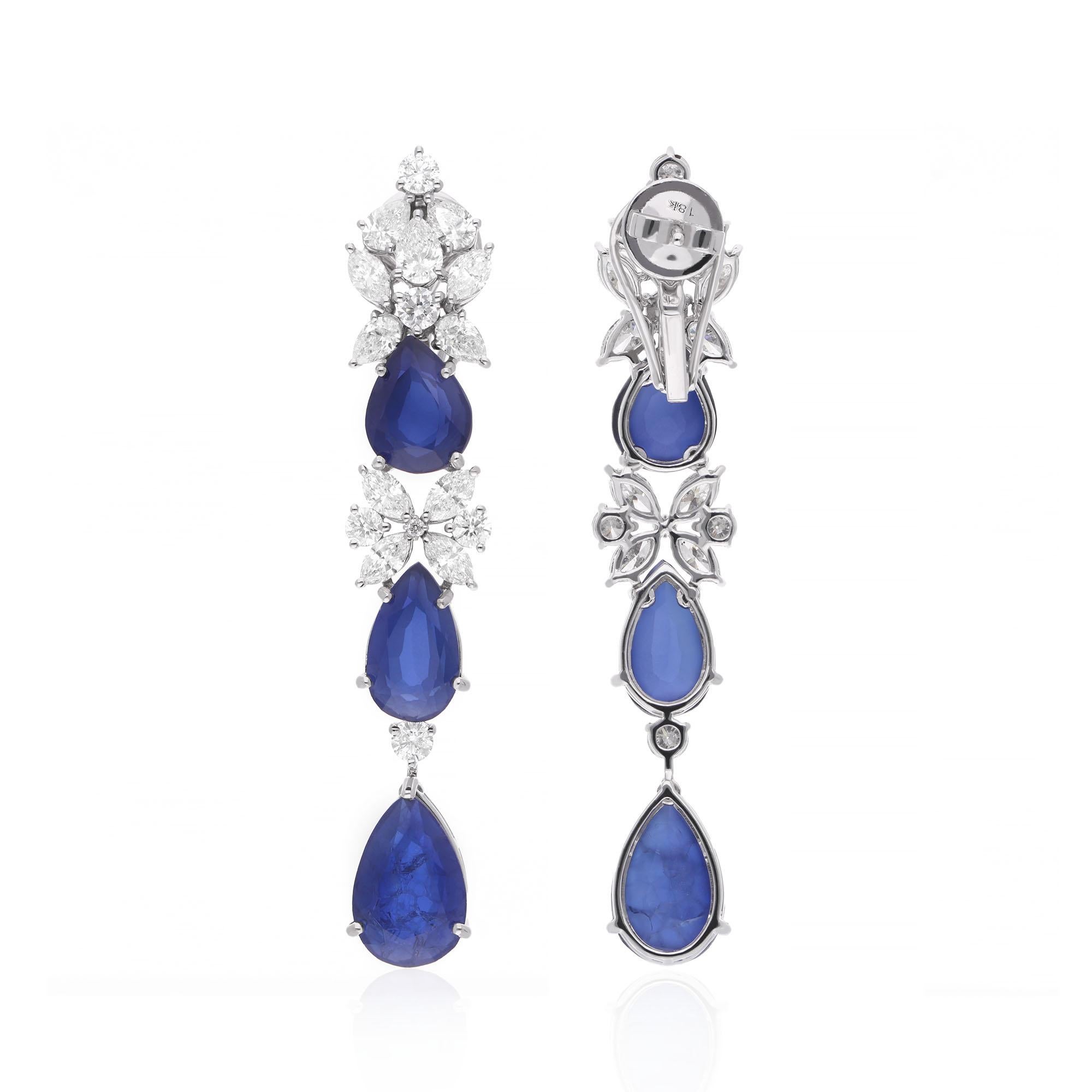 At the heart of each earring is a captivating pear-shaped processed gemstone, meticulously cut and polished to perfection. The processed gemstone exudes a mesmerizing brilliance and depth of color, adding a touch of allure to the design.

Item Code