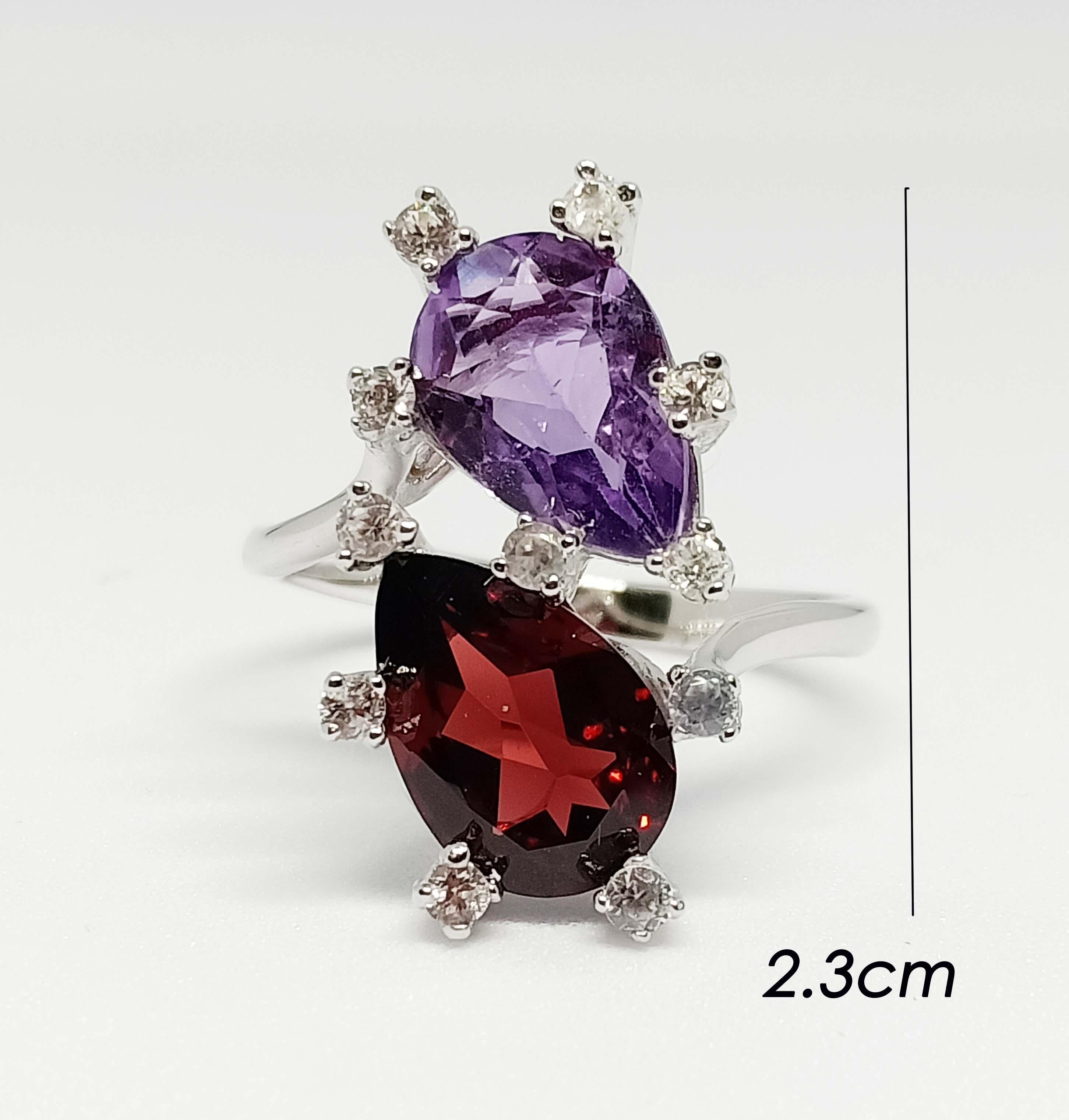 Garnet pear 3.20cts 1 pc.
Amethyst pear 2.40 cts. 1 pc.
White zircon round 2 mm 11 pcs.
White gold Plates over sterling silver
size 10 us.

Can be smaller resizable free. take up 7 days before ship.