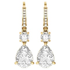 Pear & round cut moissanite vintage moissanite 14 gold earrings.
