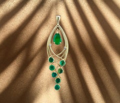 Pear, round emerald pendant.
