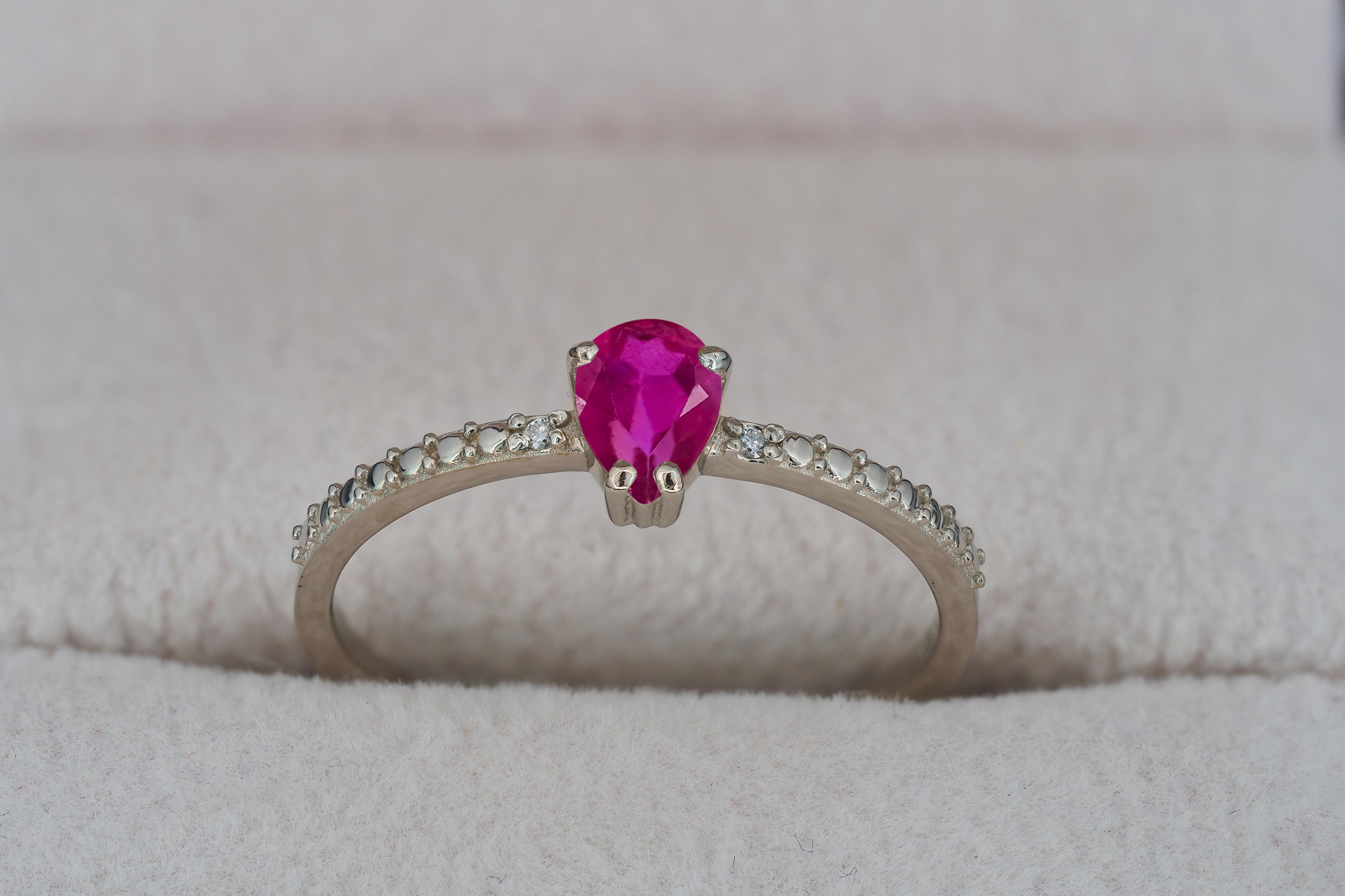 Modern Pear ruby 14k gold ring. For Sale