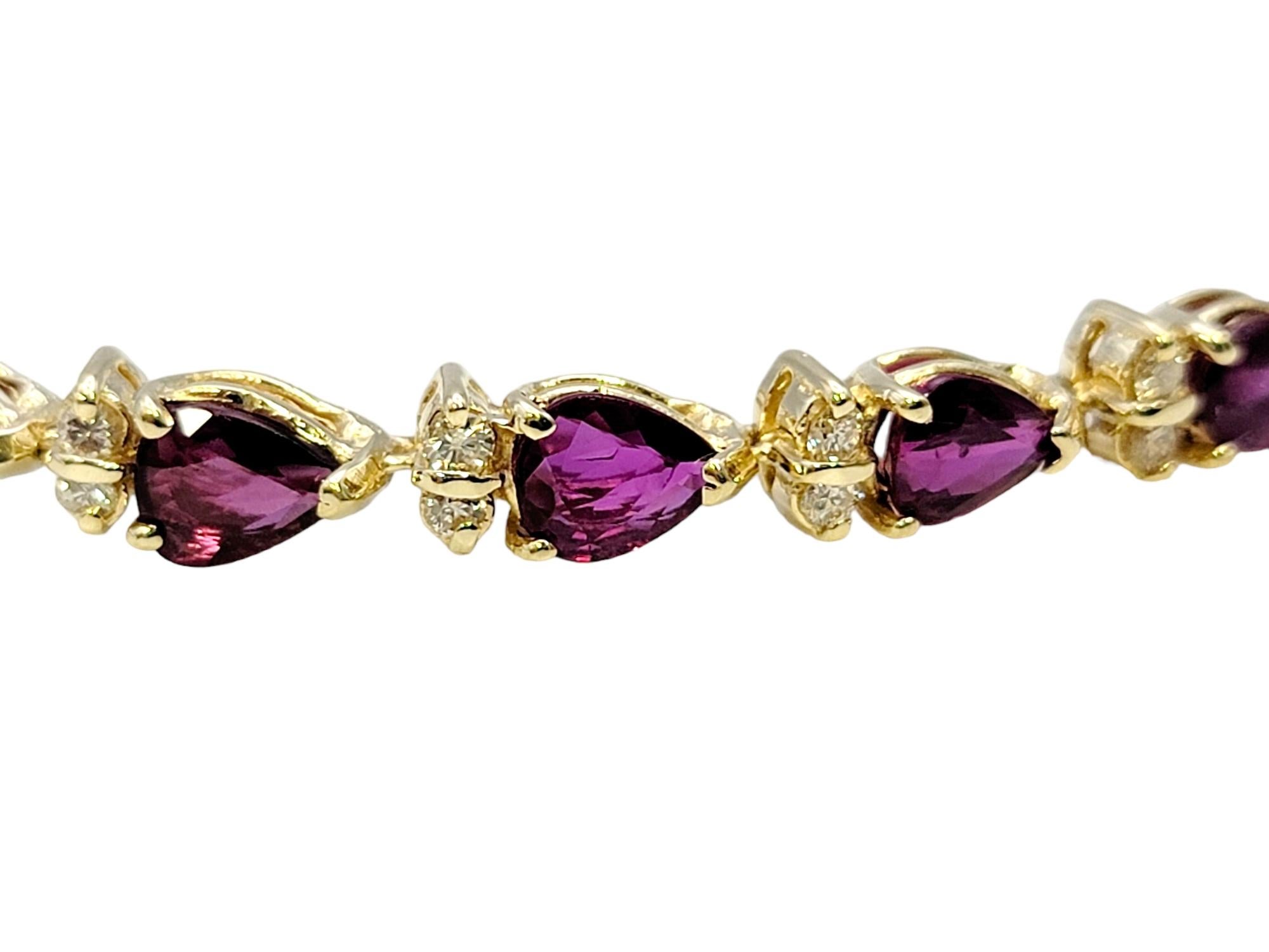 Pear Cut Pear Ruby and Round Diamond Station Line Bracelet in 14 Karat Yellow Gold