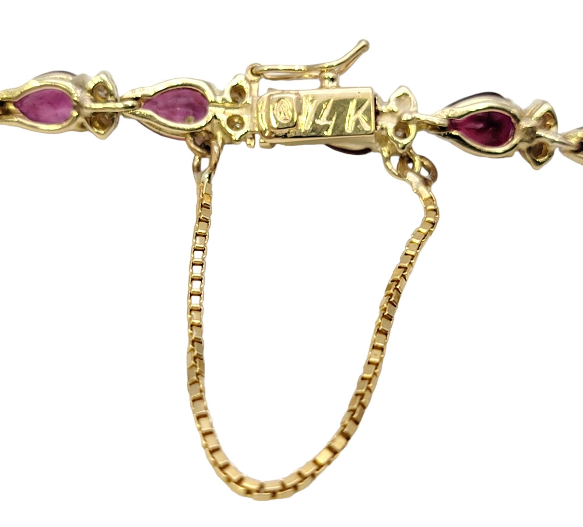 Women's Pear Ruby and Round Diamond Station Line Bracelet in 14 Karat Yellow Gold