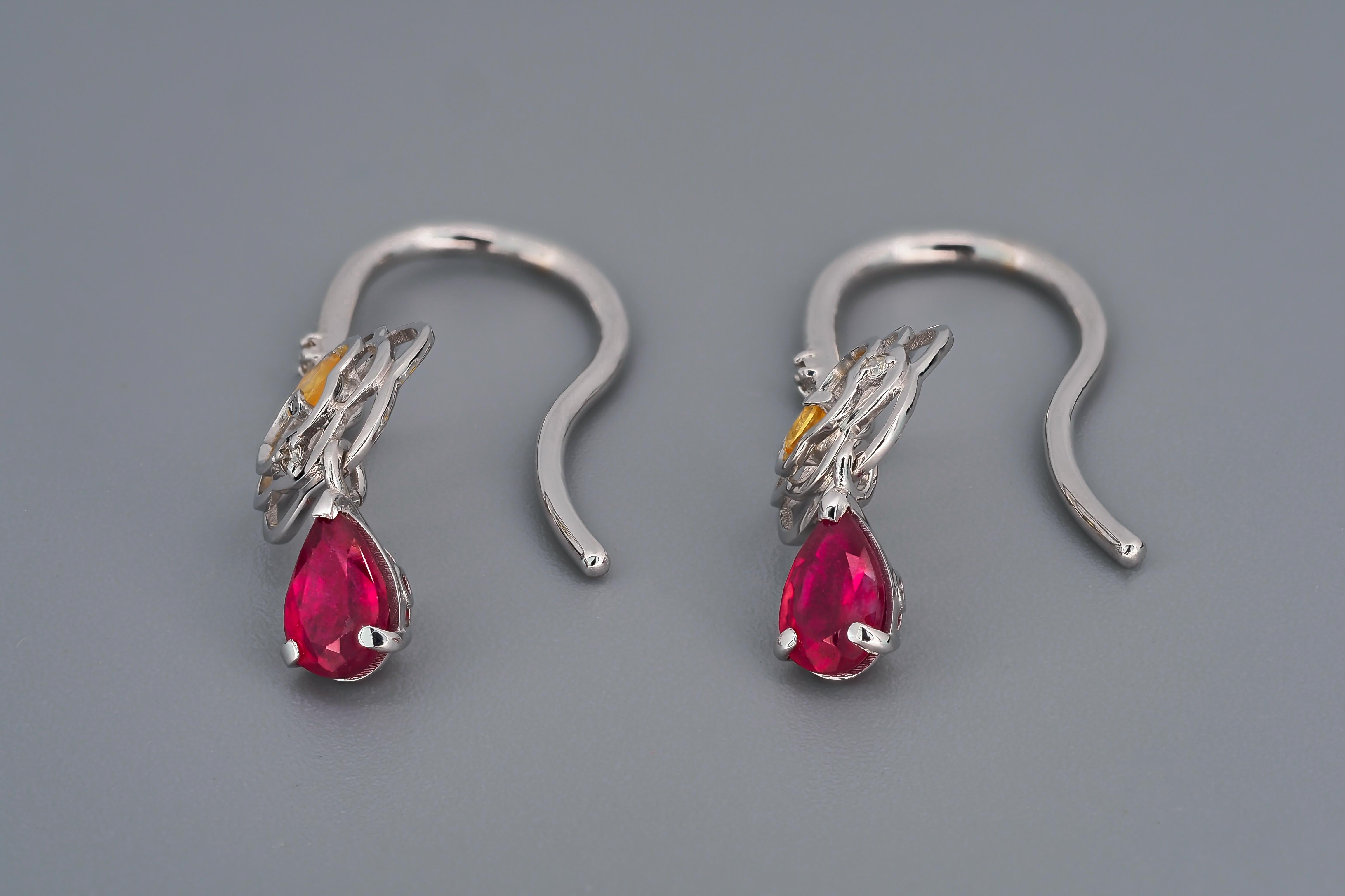 Women's Pear ruby drop earrings in 14k gold.  For Sale