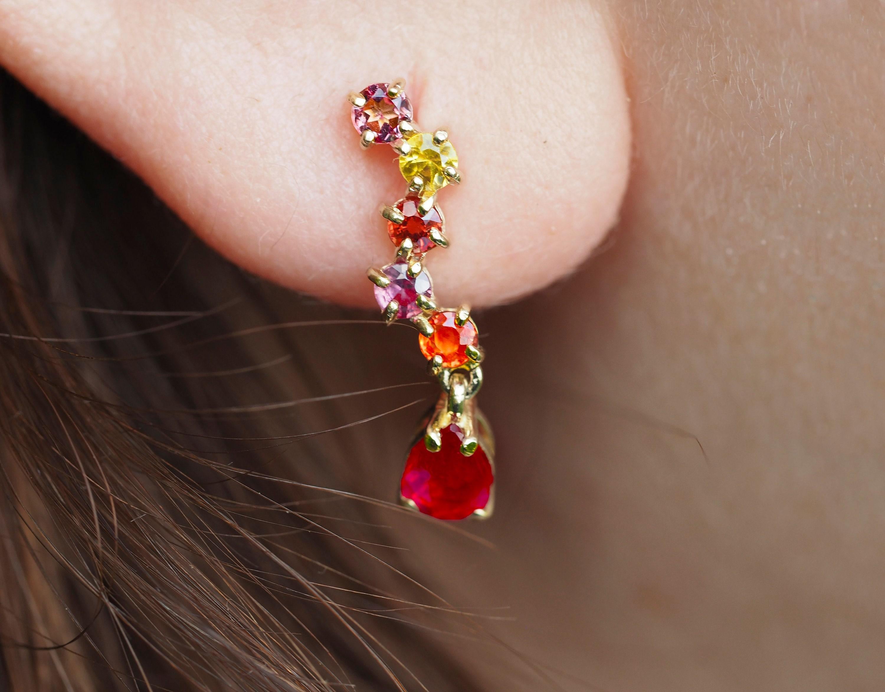 925 silver earrings studs with pear rubies and sapphires.

Total weight: 2.30 g.
Metal: 925 silver
Size: 20 x 5 mm.

Central stones: Rubies - 2 pieces
Cut: Pear
Weight: approx 1.2 ct. total.
Color: Red
Clarity: Transparent with inclusions
Sapphires: