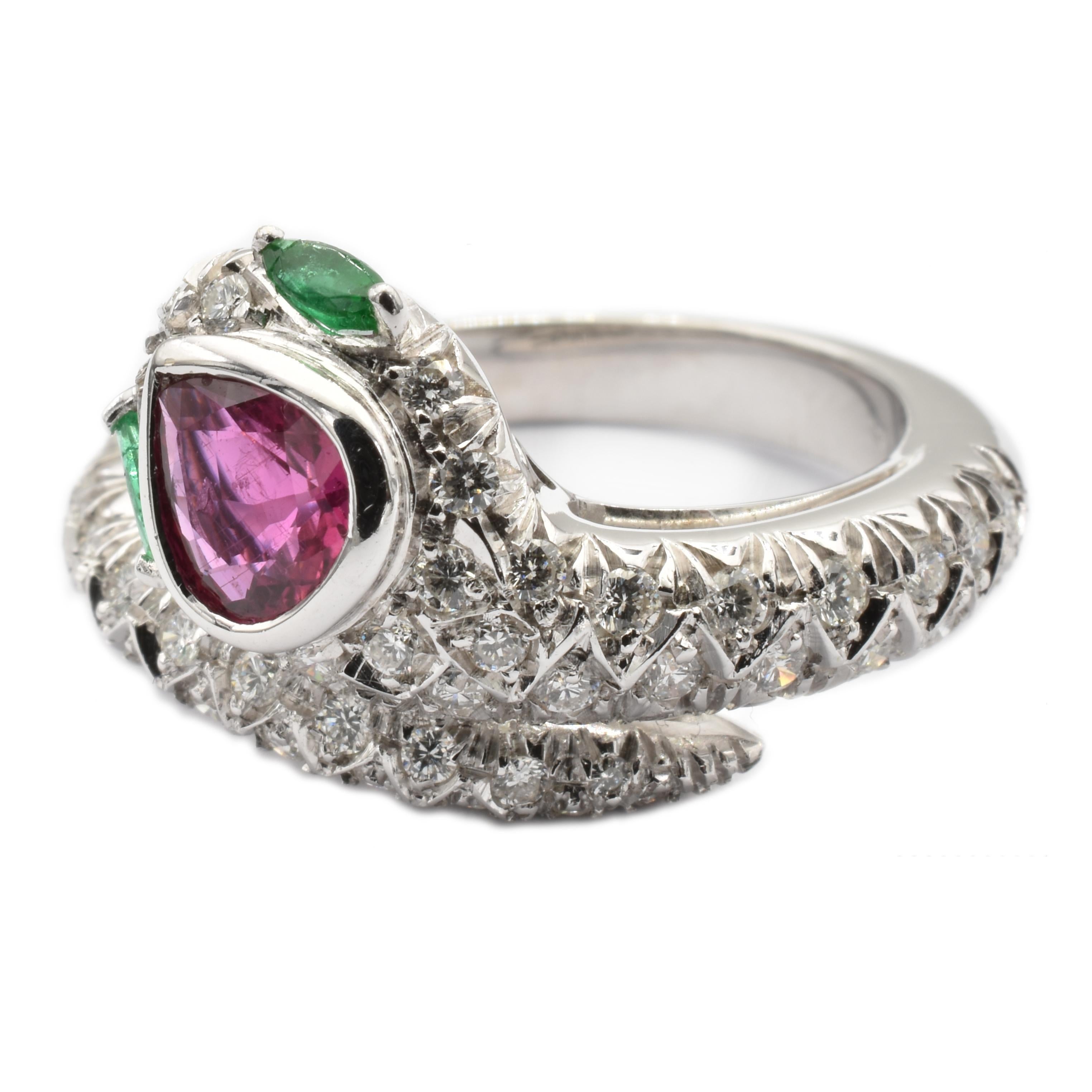 Gilberto Cassola 18Kt White Gold Snake Ring with a Pear Ruby, two Marquise Emeralds and Diamonds.
Handmade in our Atelier in Valenza Italy.
Intense Red Natural Ruby Pear sized mm 7.80 X 4.20.  Weight ct 0.77
Bright Green Natural Emerald Marquises