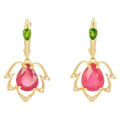 Pear ruby flower 14k gold earrings.