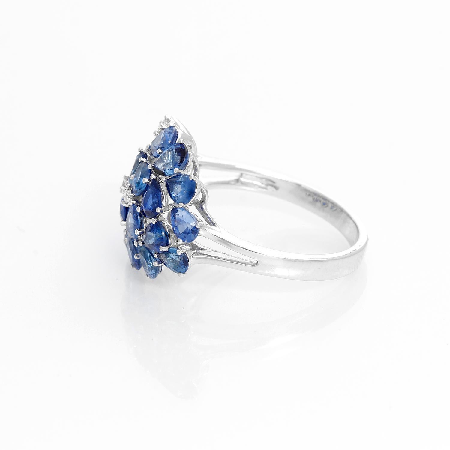 Pear Sapphire and Diamond 14K White Gold Ring Size 8 - Cluster Sapphire ring with 4.48 cts. A few hints of diamond peek from within the bouquet of blue stones. Crafted in 14K white gold with 0.07 carats of diamond accent. Size 8 but can be sized.