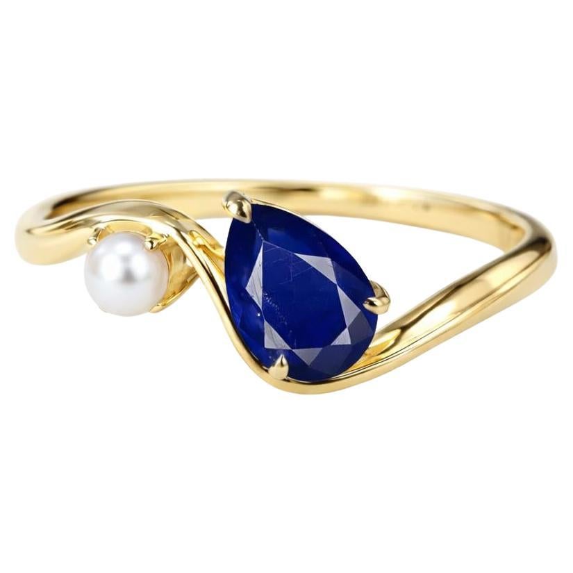 Anillo de oro de 14k con zafiro pera y perla